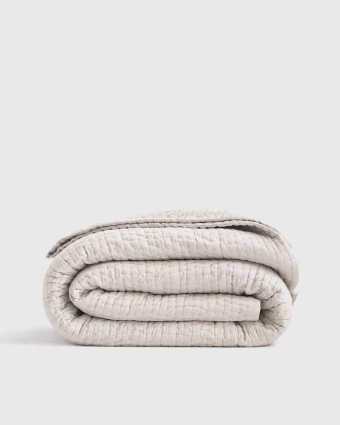 Ivory Courtepointe en soie à points sellier