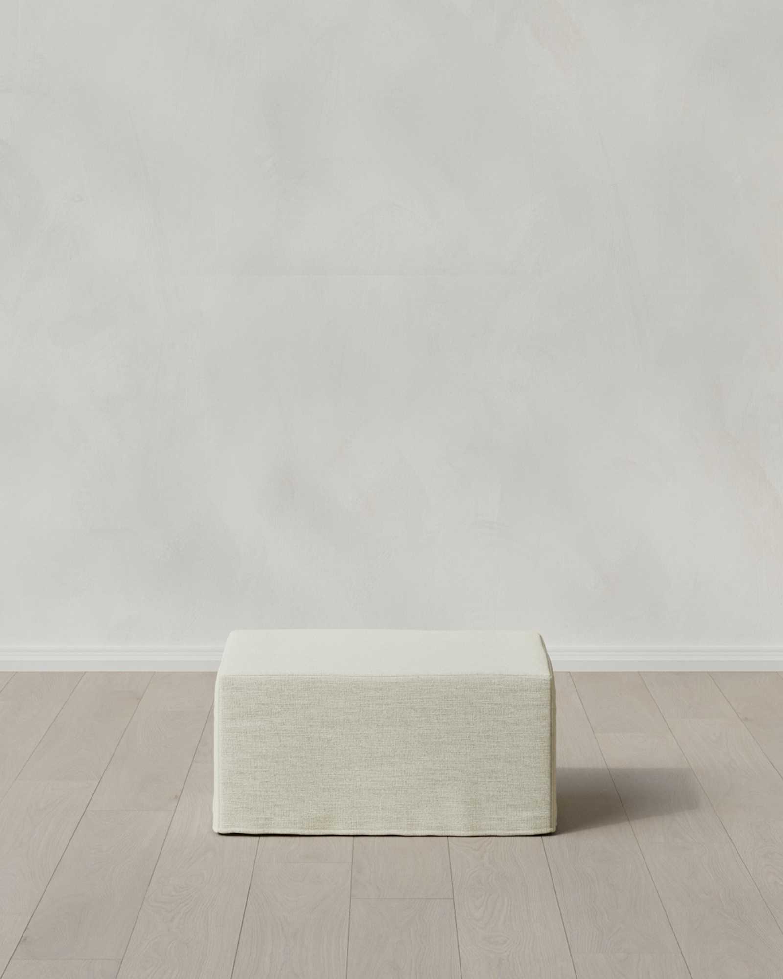 Ivory Ellery Slipcover Ottoman in Performance Linen