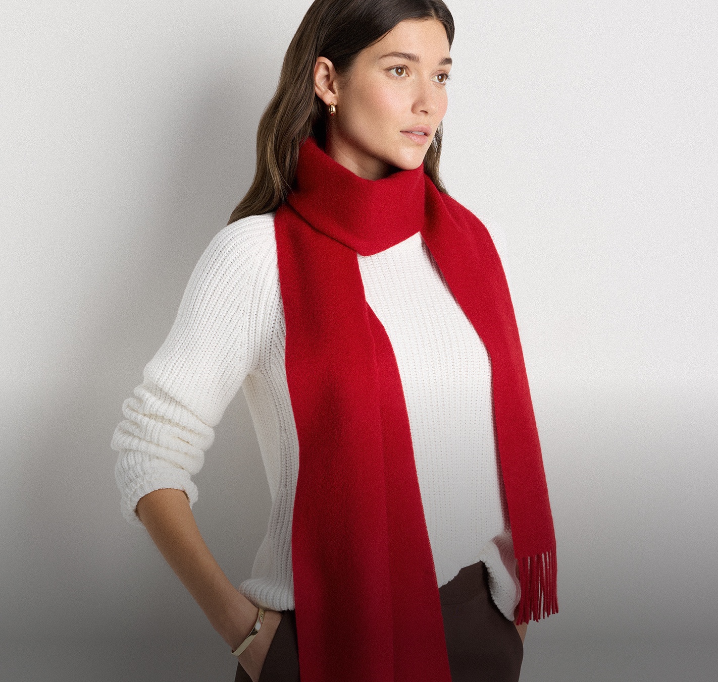 Model in a Varsity Red Mongolian cashmere fringe scarf and an ivory knit — Container 3 banner, UK homepage, 15 Oct 2026