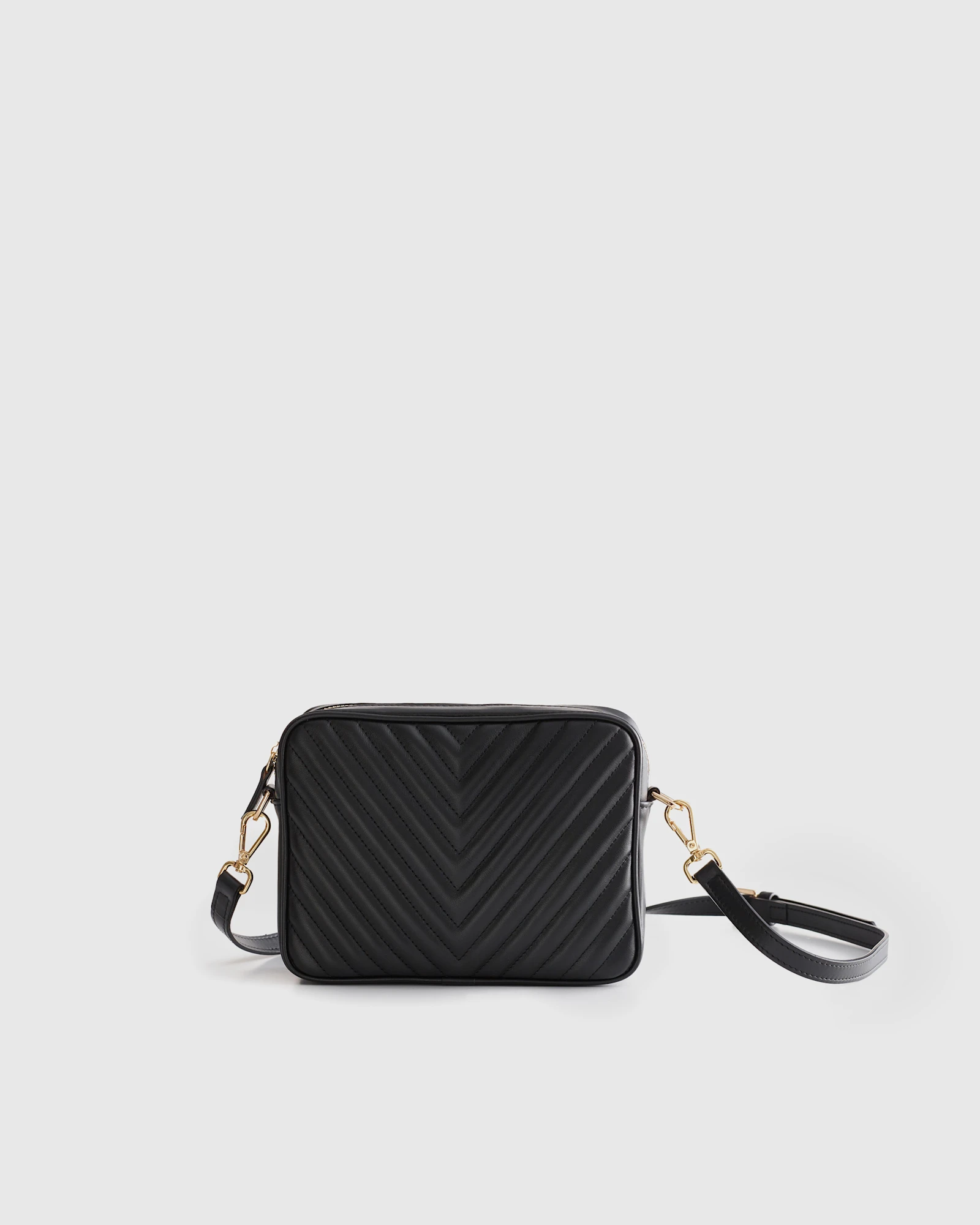 Quince Italian Leather Quilted Crossbody Bag featuring a classic black quilted pattern