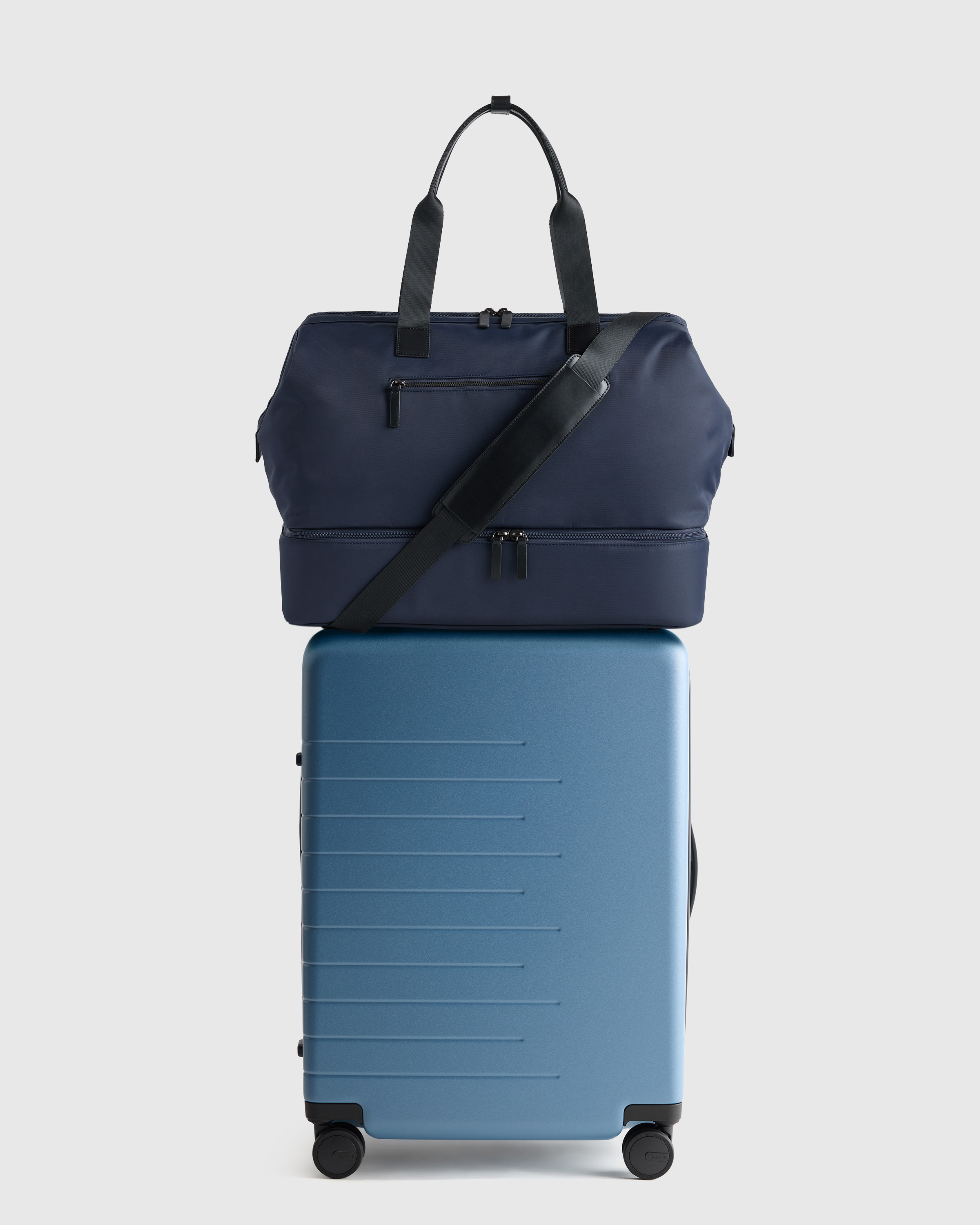 Overpacker Bundle - Blue large suitcase, black duffle