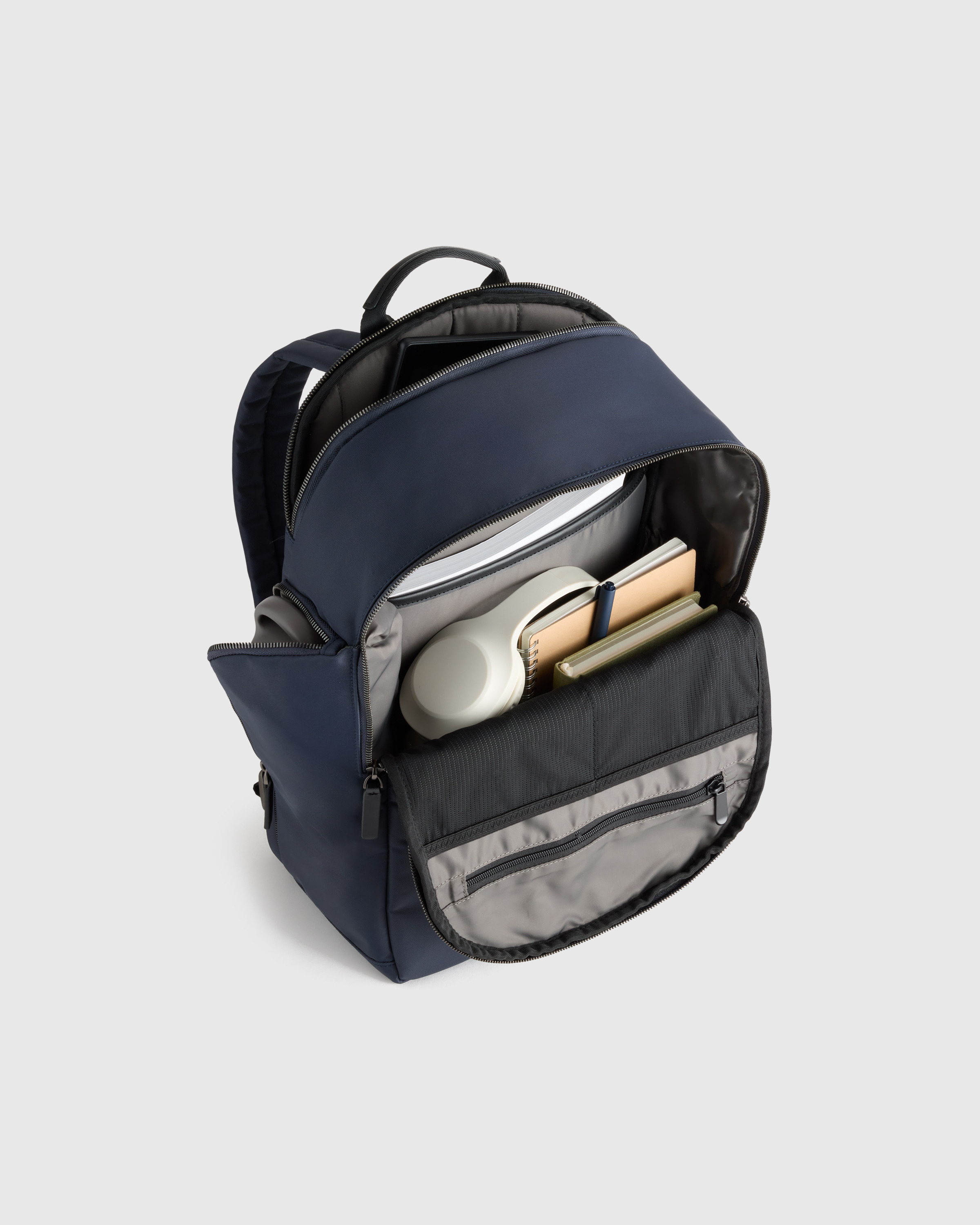 Voyage Nylon Slim Travel Backpack in Navy | Quince Canada