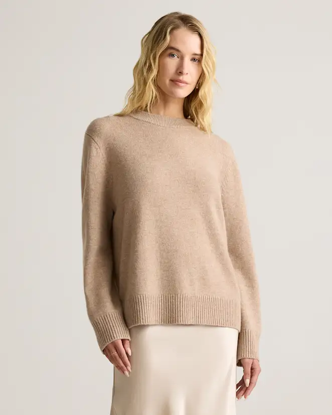 Thrifted cashmere sweater with snakeskin boots