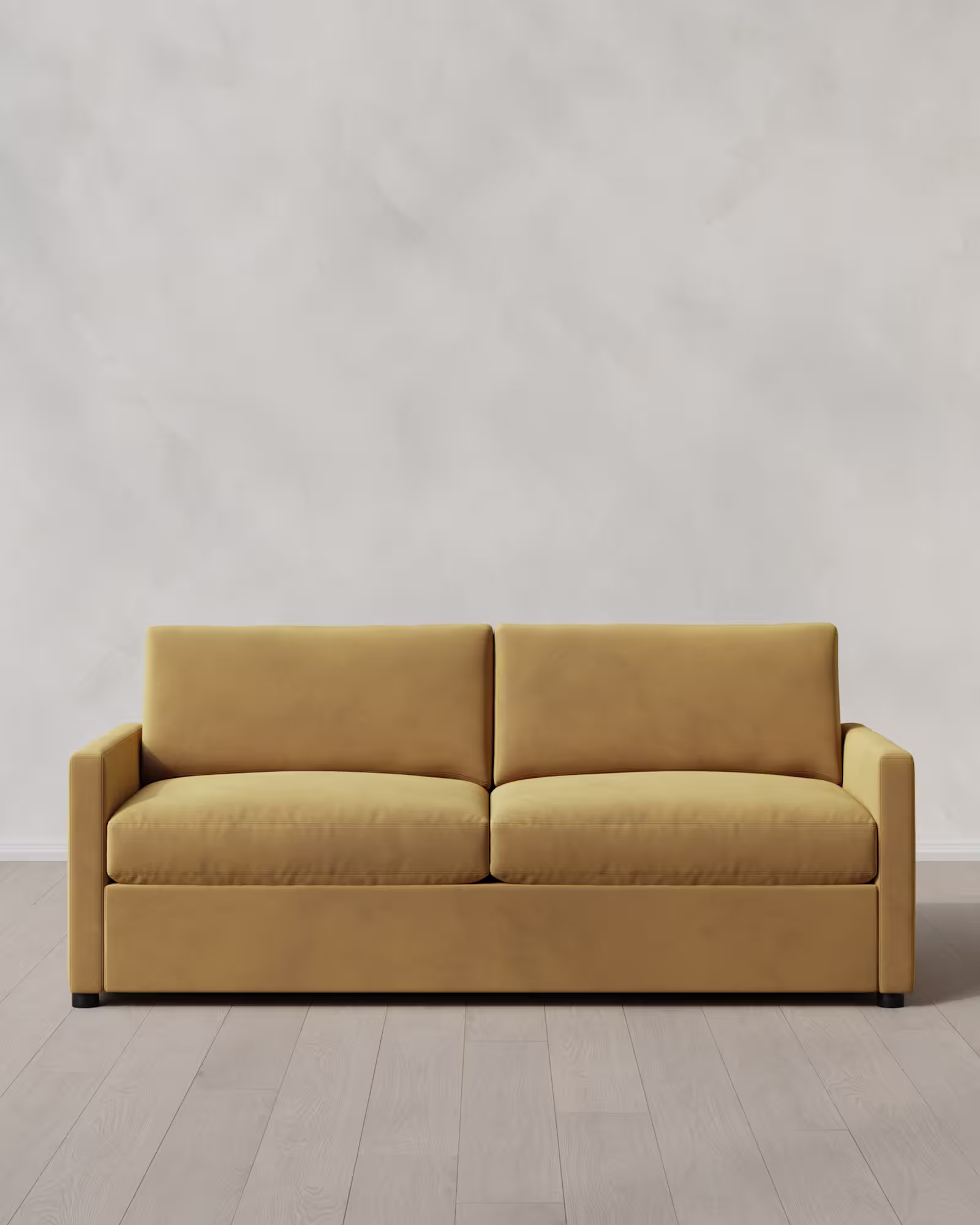 Mustard colored velvet sleeper sofa.